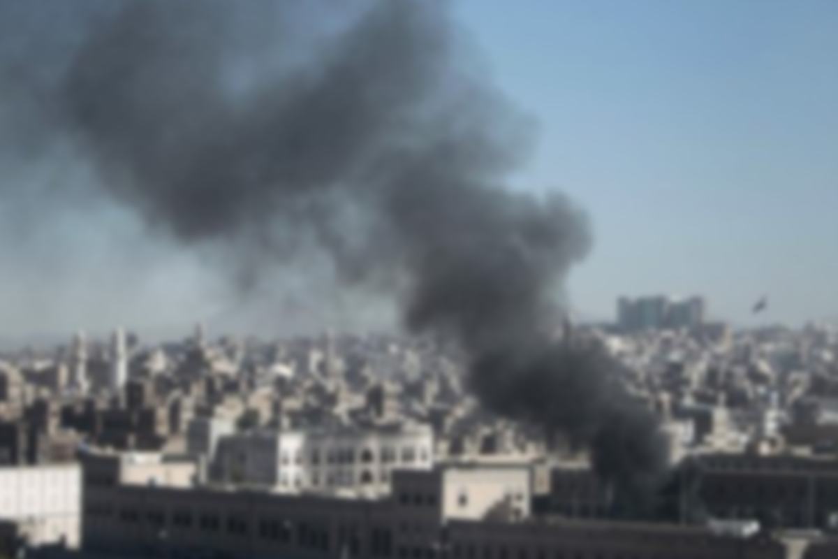Smoke rising over a city
