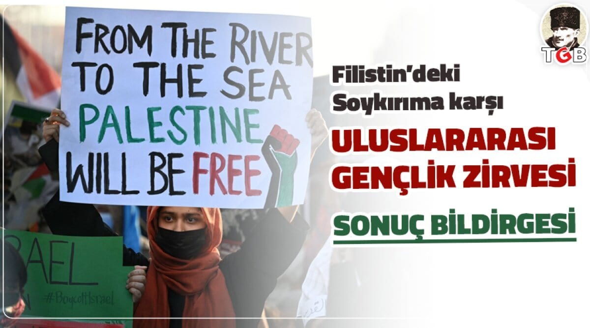 A demonstrator holding a placard reading "From the river to the sea Palestine will be free".