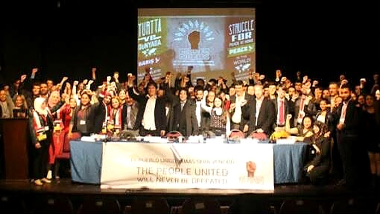 Delegates raising their fists on stage at the founding congress of WAYU in Istanbul, 2014